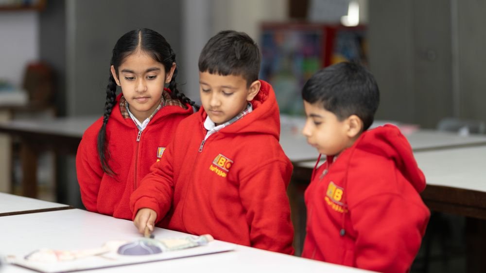 Children studying in a primary school classroom