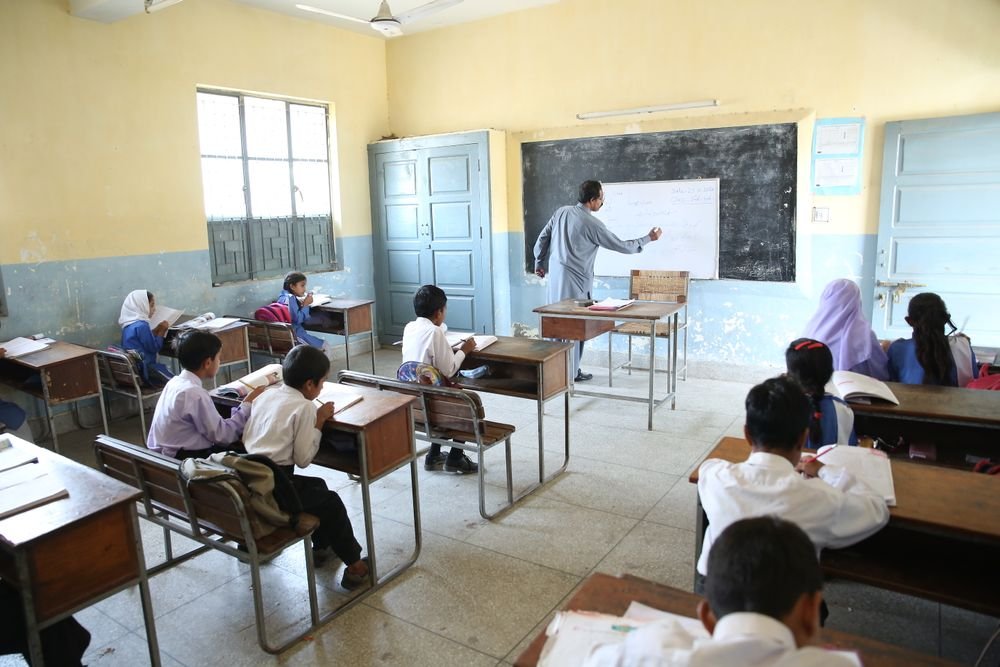 Students listening to their teacher