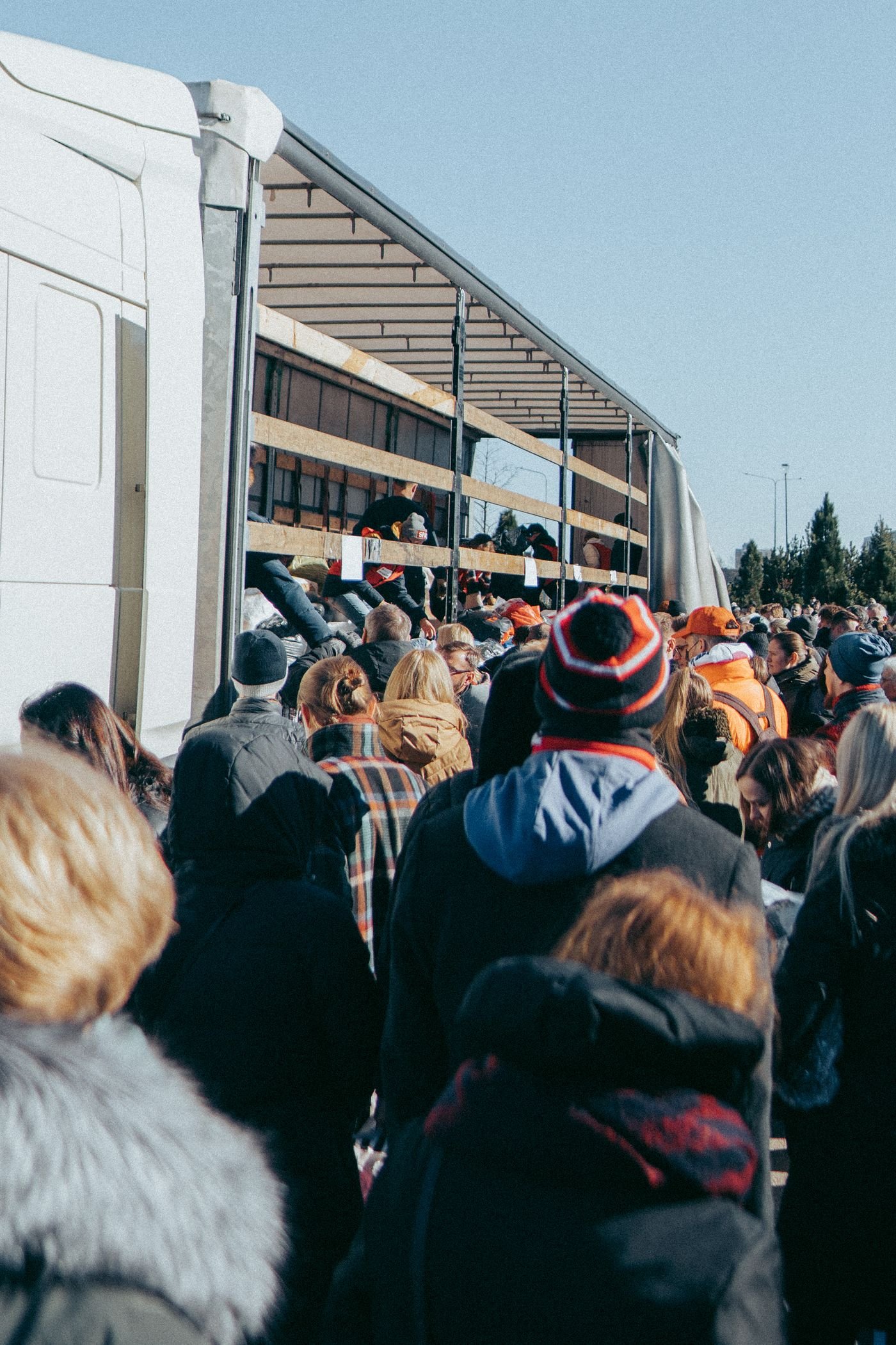 Community gathering around an aid truck