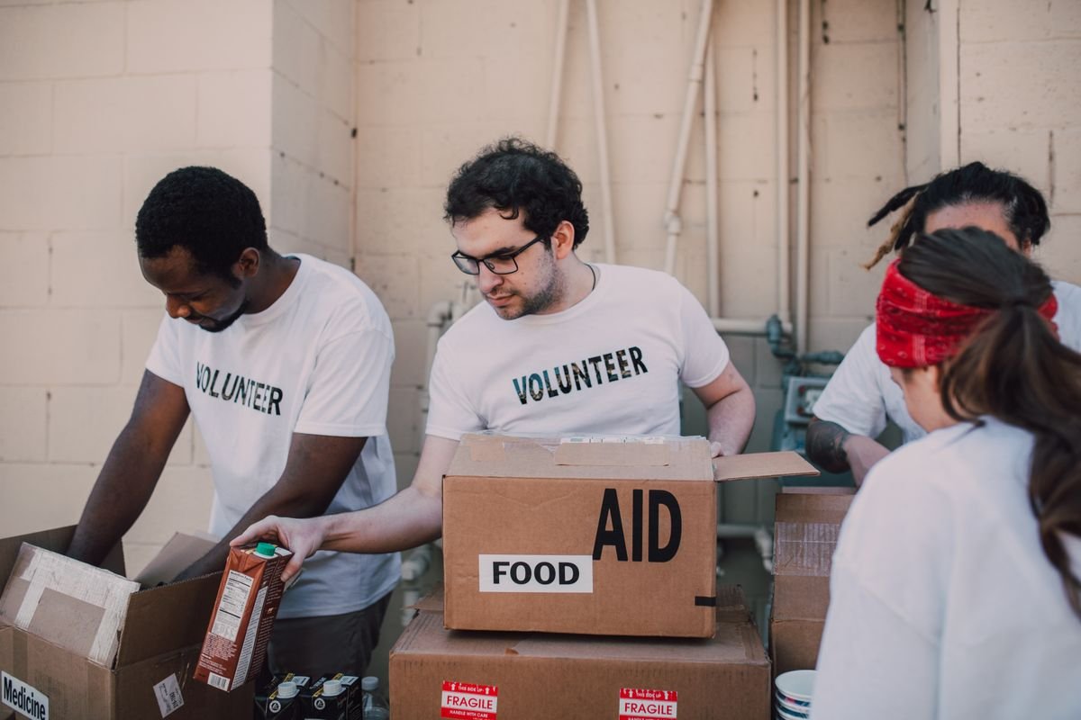 Volunteers packing food and aid boxes