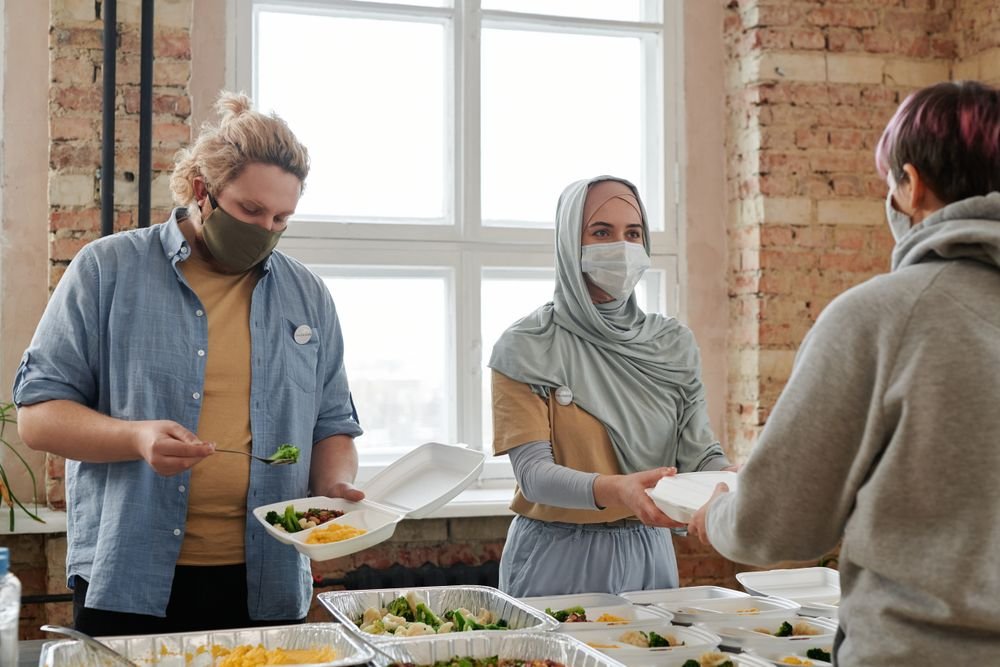 Volunteers handing out meals